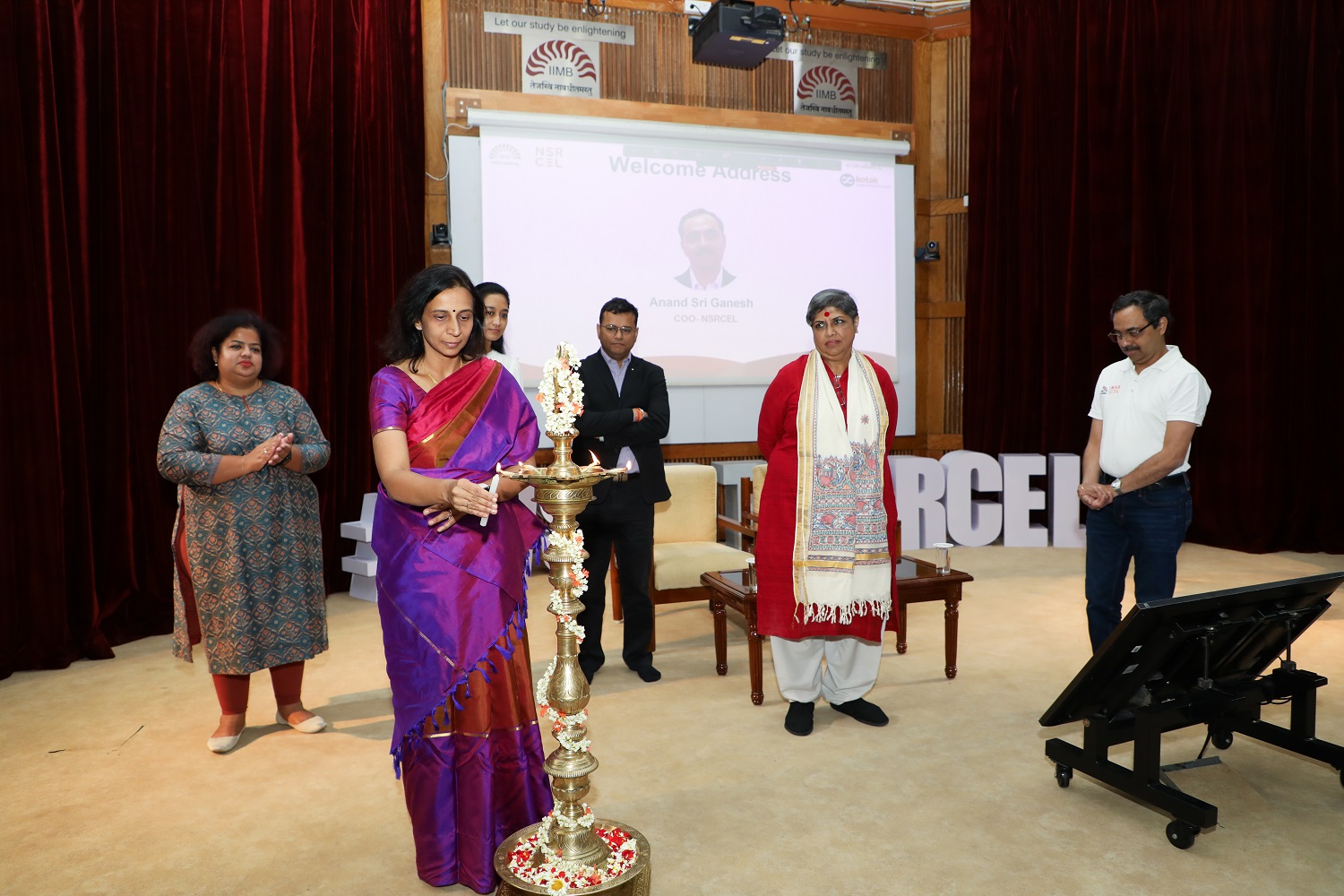 Prof. Srivardhini K Jha, Chairperson, NSRCEL, IIMB, lights the lamp to inaugurate NSRCEL’s Women Startup Program incubation launch, on 9th March 2023. Anand Sri Ganesh, COO, NSRCEL at IIMB, Malavika R Harita, Member of the Board of Governors at IIMB, Himanshu Nivsarkar, Executive Vice President & Head, CSR, Mabel Chacko, Co-Founder and COO, Open Financial Technologies, Ankita Pegu, Program Head, Women Startup Program, NSRCEL, IIMB, look on.